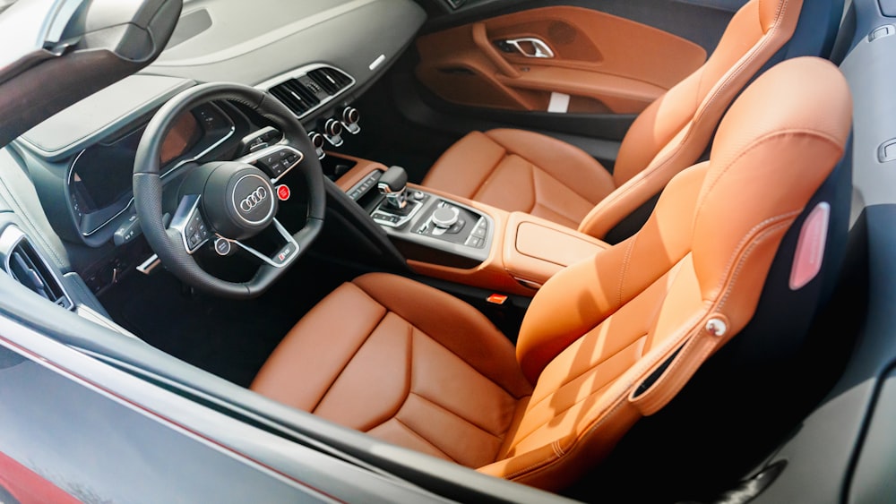 the interior of a car with leather seats