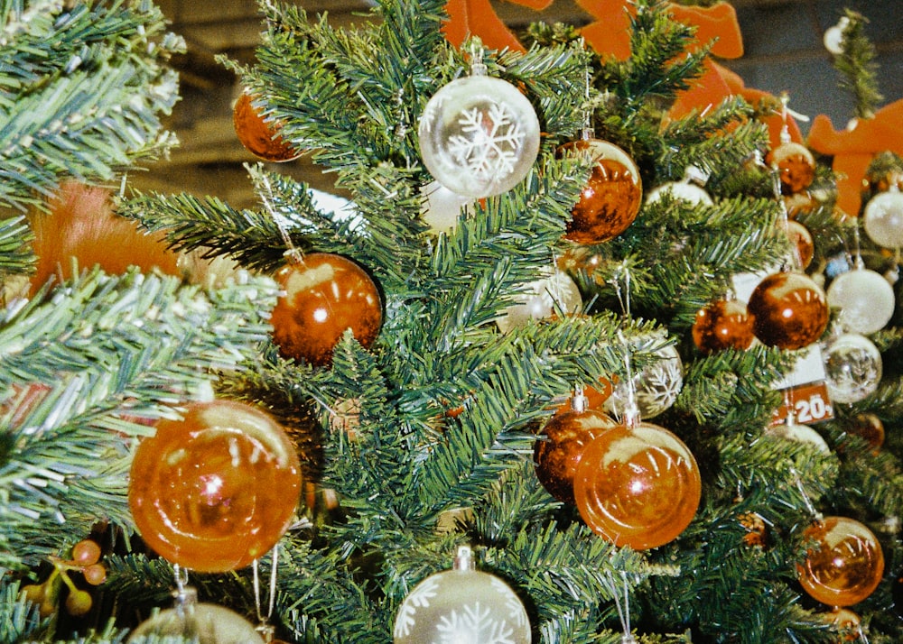 a close up of a christmas tree with ornaments