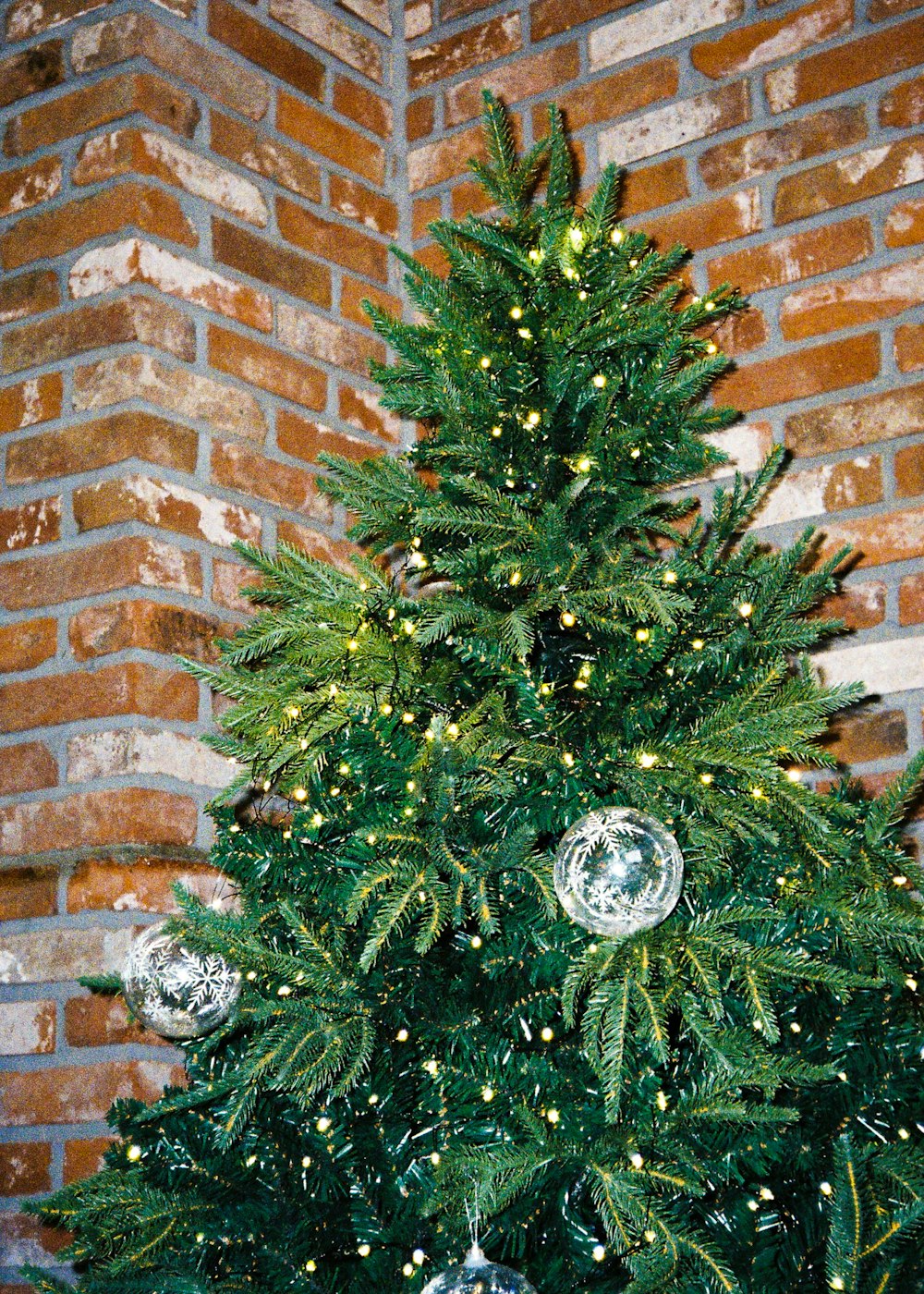 a small christmas tree with ornaments on it