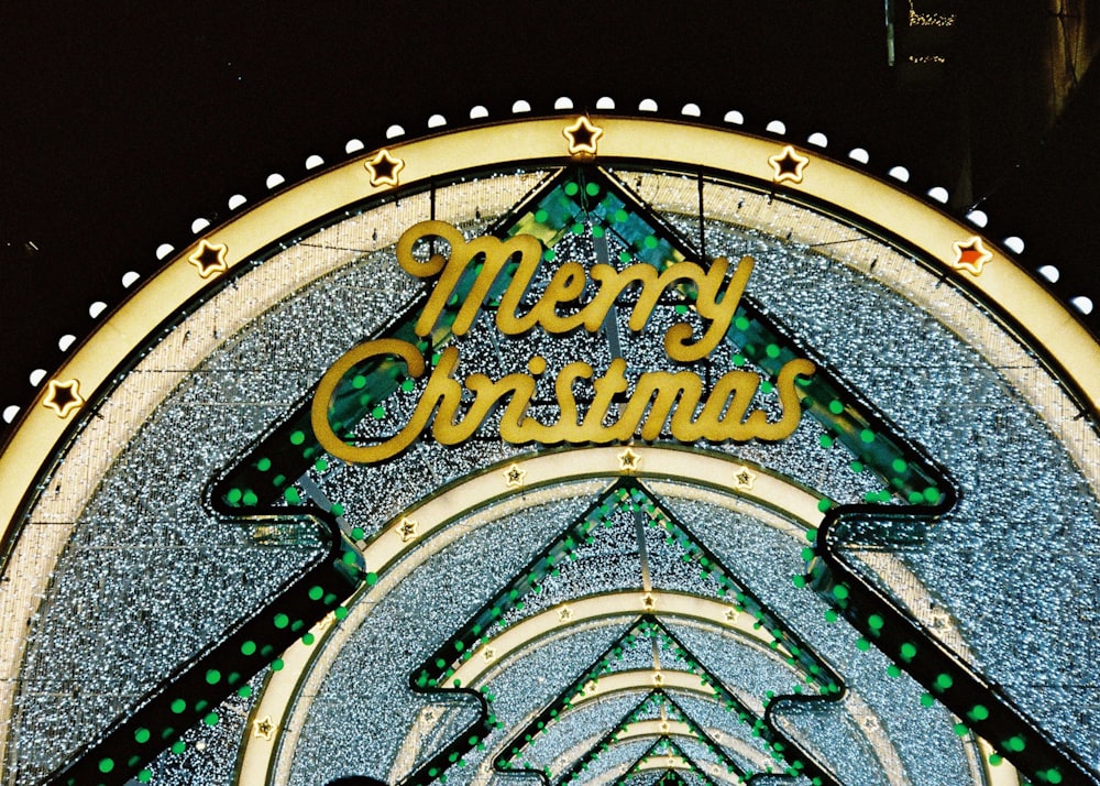 a merry christmas sign on the side of a building