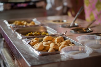 a buffet table filled with different types of food