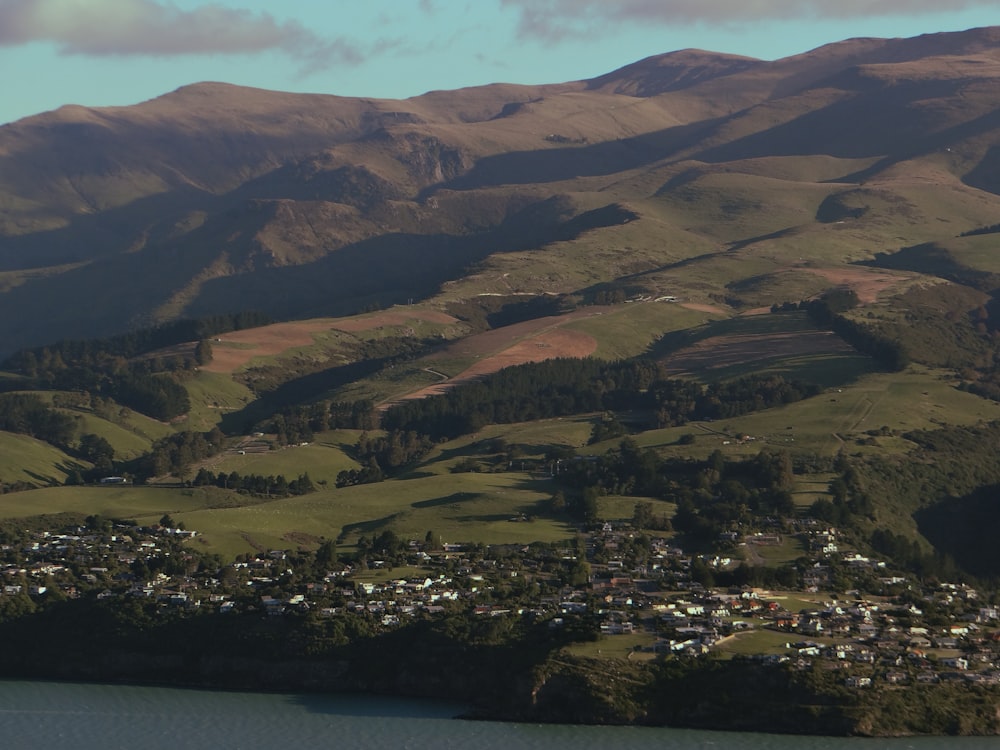 a scenic view of a town in the mountains