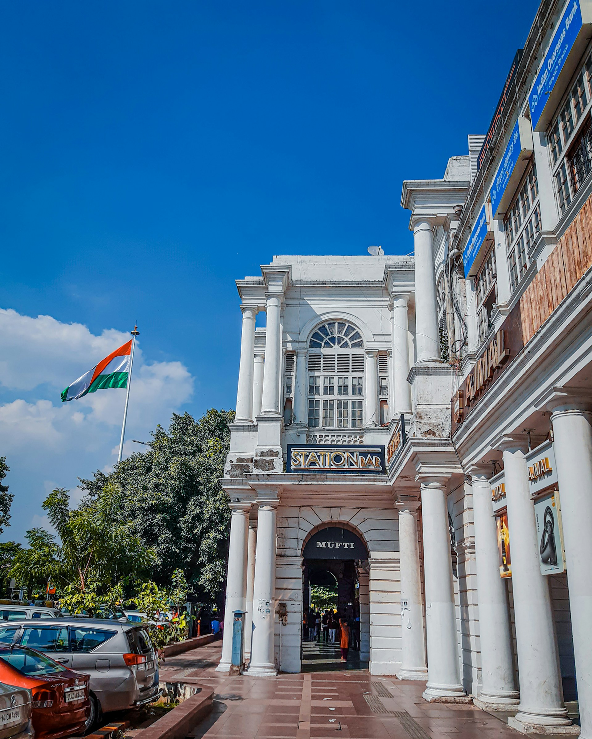 woman wearing yellow long-sleeved dress under white clouds and blue sky during daytime