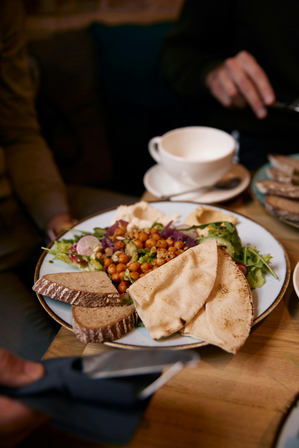 a plate of food on a wooden table