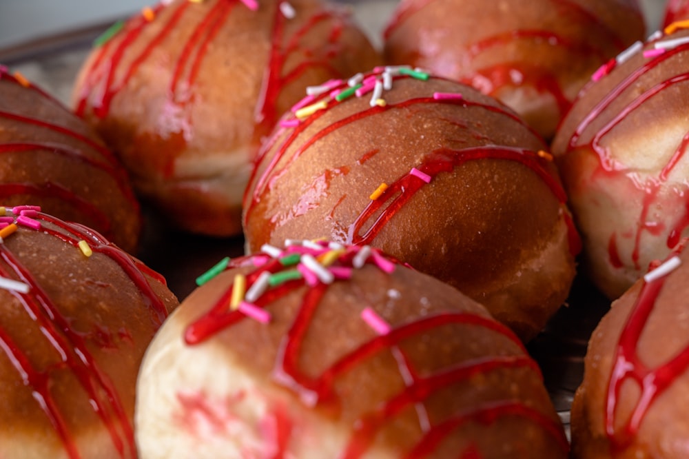 a bunch of doughnuts with sprinkles on them