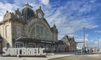 a large building with a clock on the front of it