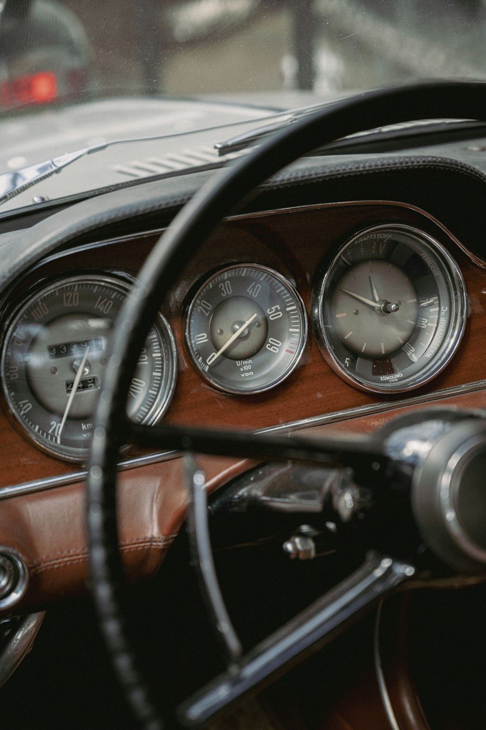 a dashboard of a car with gauges and a steering wheel