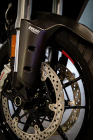 Close-up of carbon fiber pit bike parts branded for YCF and Apollo.