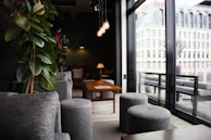 A cozy lounge space with modern decor and relaxing seating options.