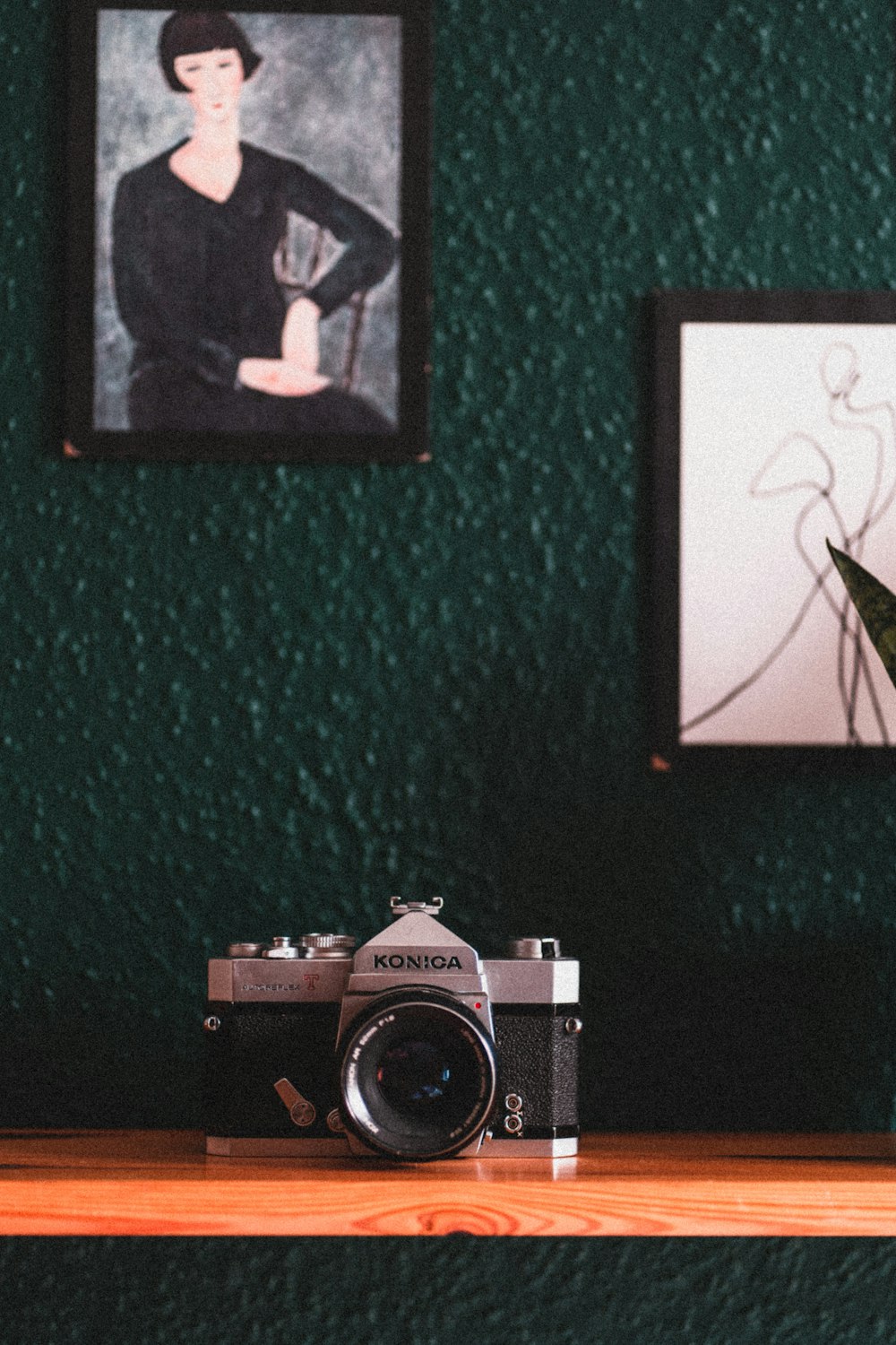 a camera sitting on top of a wooden table