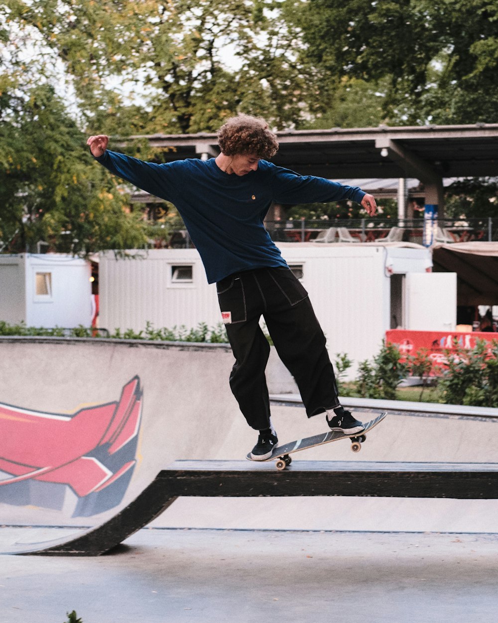 a man riding a skateboard up the side of a ramp