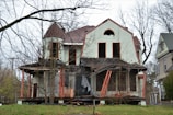A family inspecting their home for signs of disrepair.