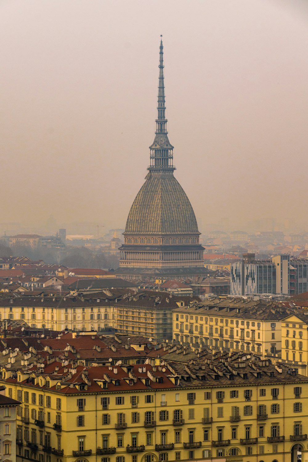 a view of a city with a dome in the background