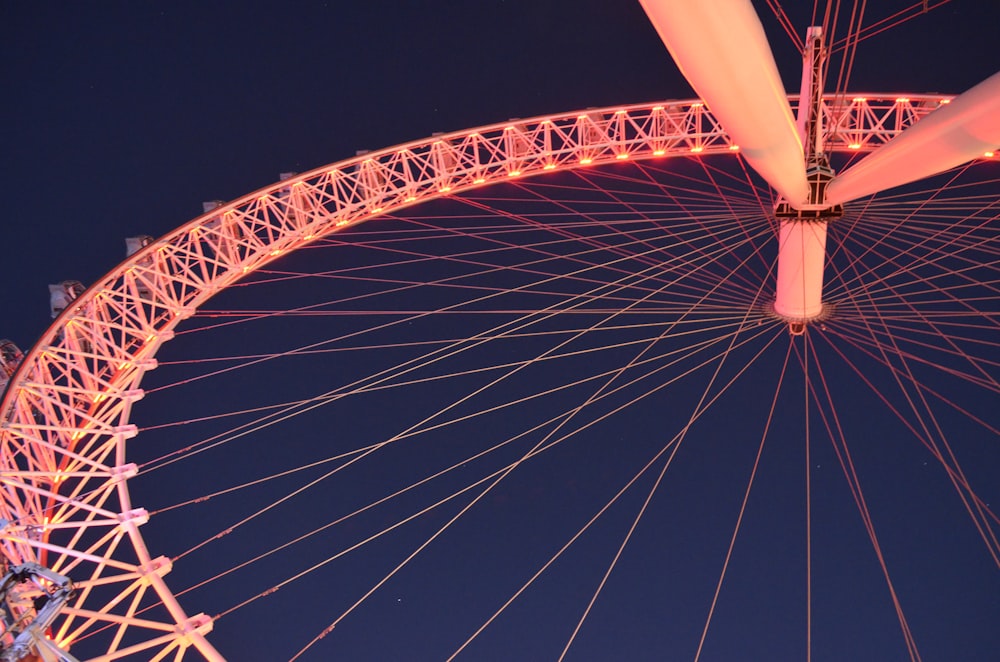 a large ferris wheel lit up at night