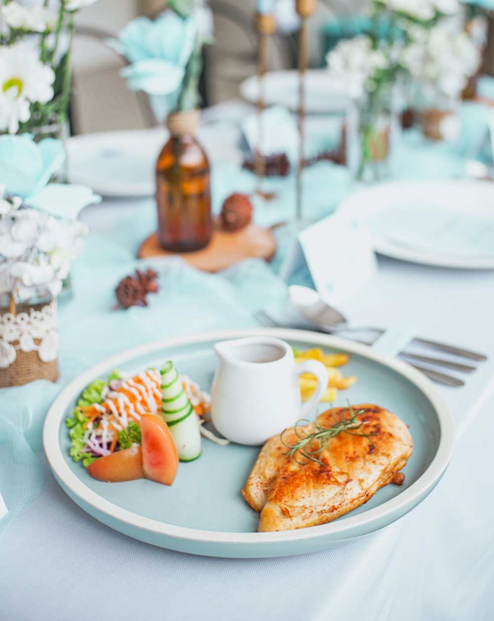 a plate of food on a blue table cloth