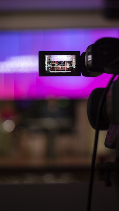 a close up of a video camera with a blurry background