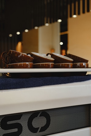 A peaceful corner with traditional cupping therapy cups arranged neatly on a wooden tray.