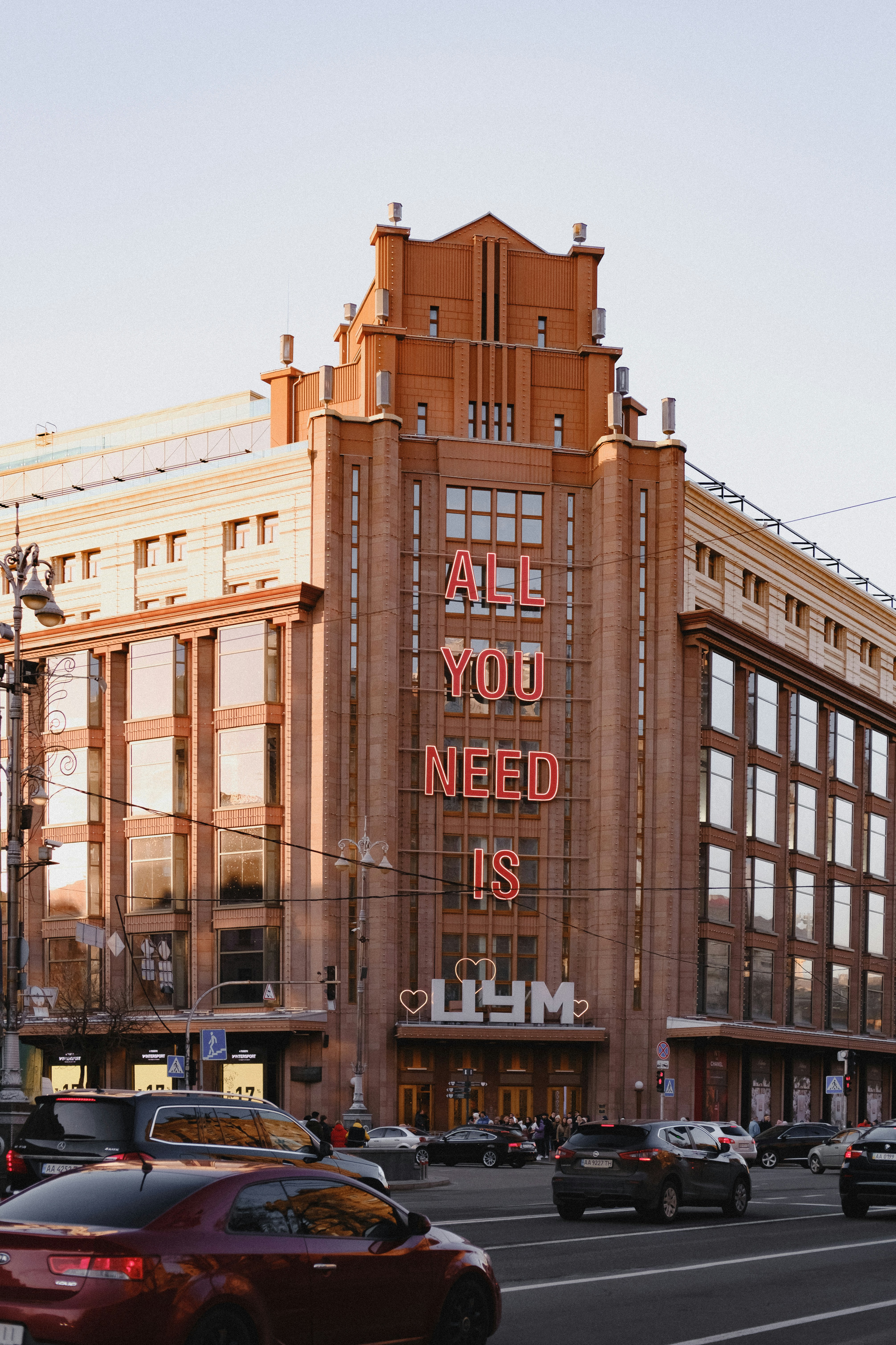 a large building with a neon sign on the side of it