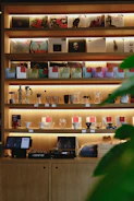 Tools, small appliances, and audio-video gadgets displayed on shelves