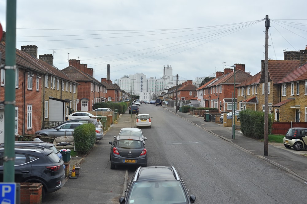 cars parked on the side of the road in a residential area