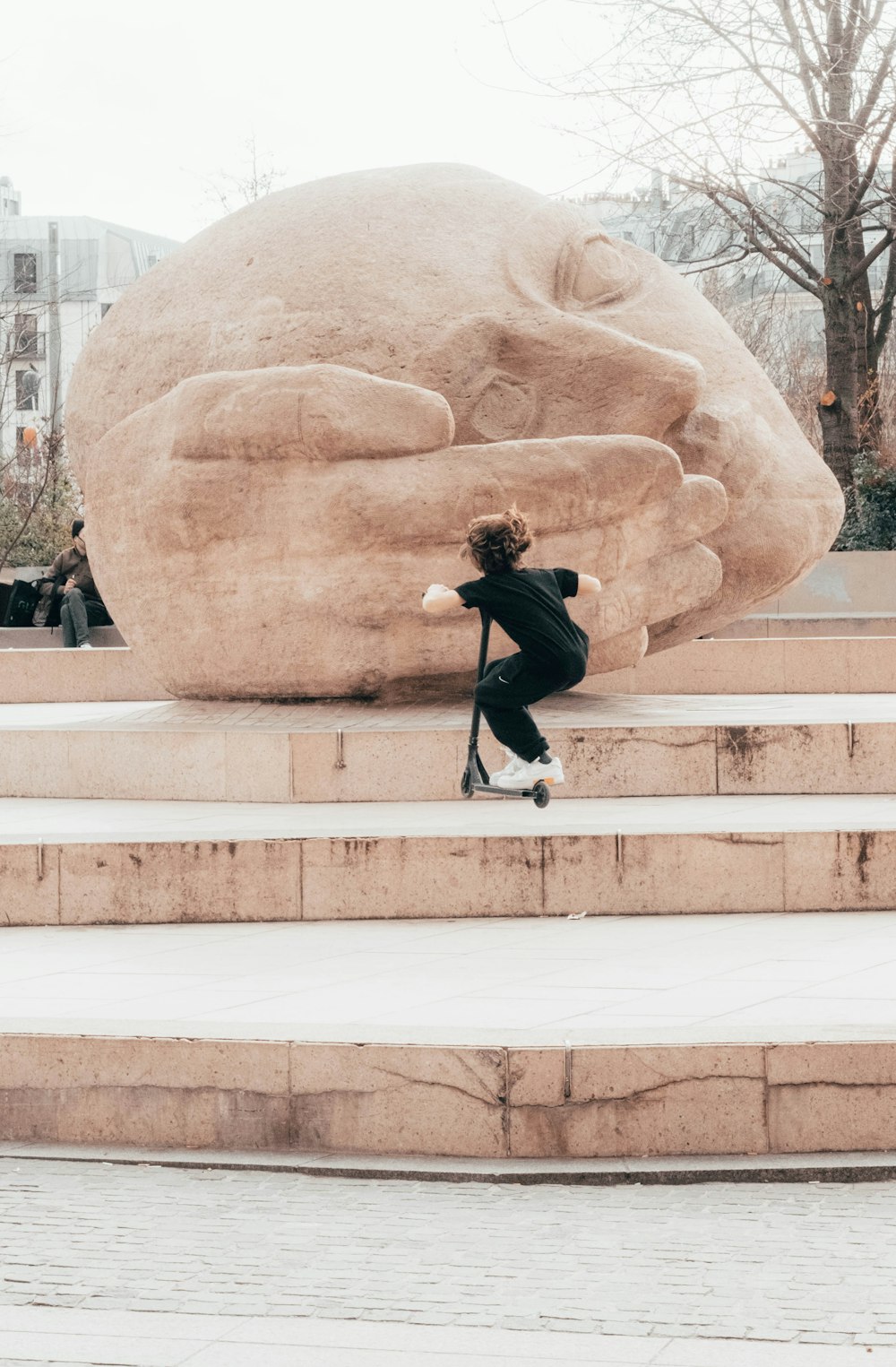 a statue of a man doing a trick on a skateboard