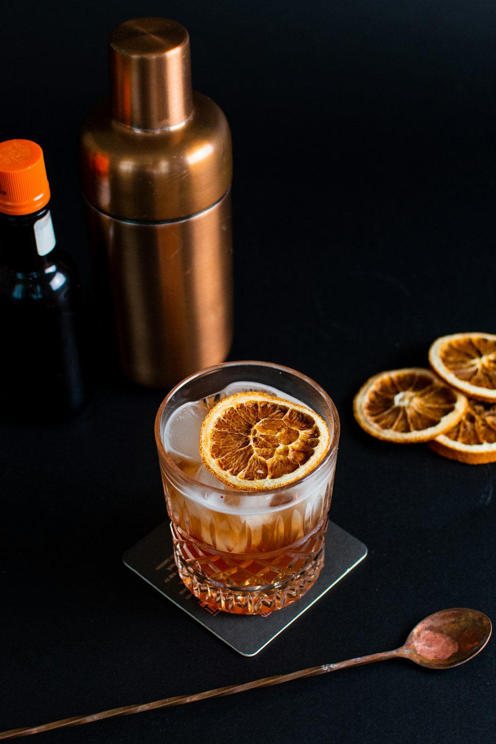 a drink with a slice of orange on the rim