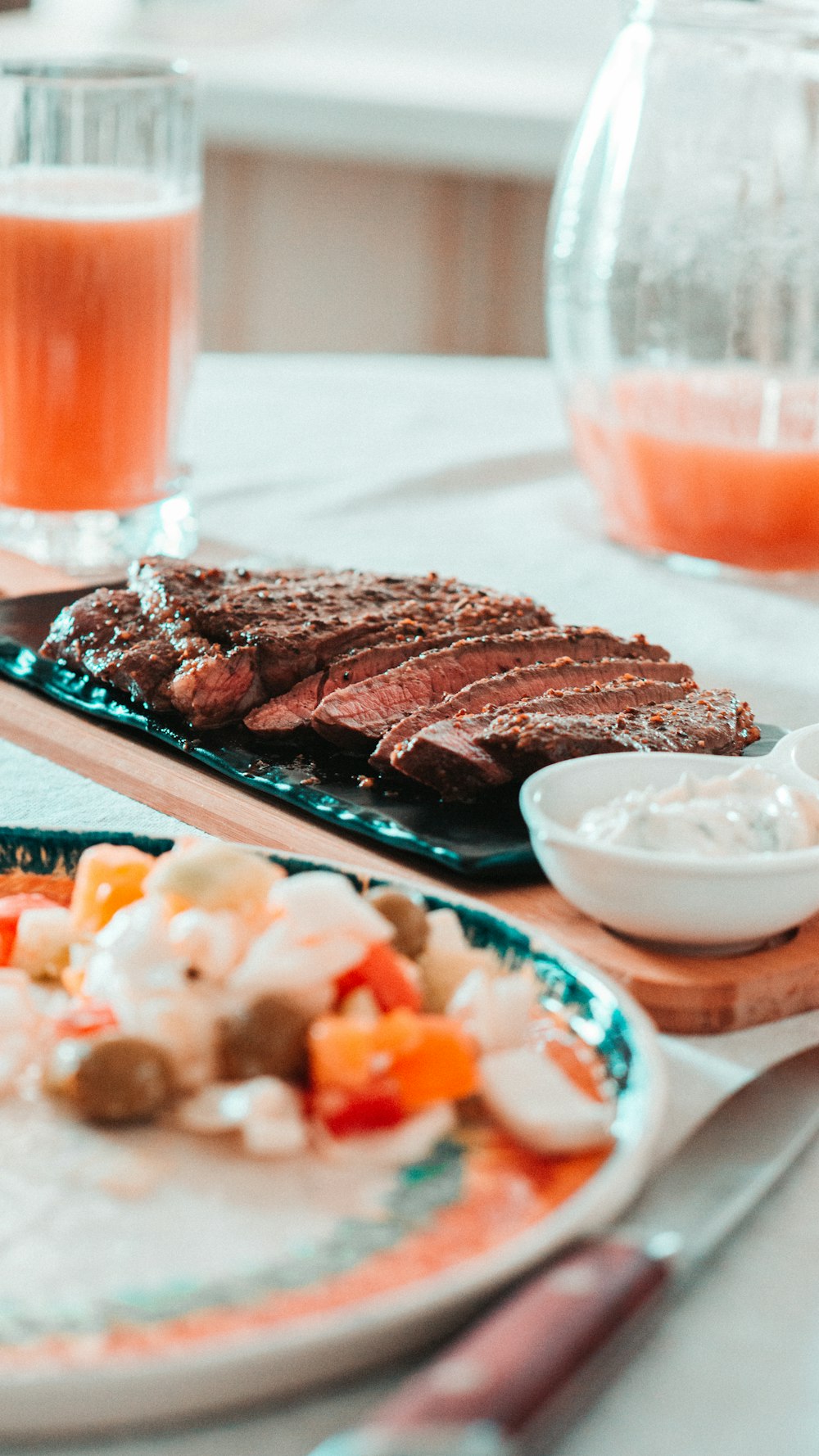 a plate of meat and vegetables on a table