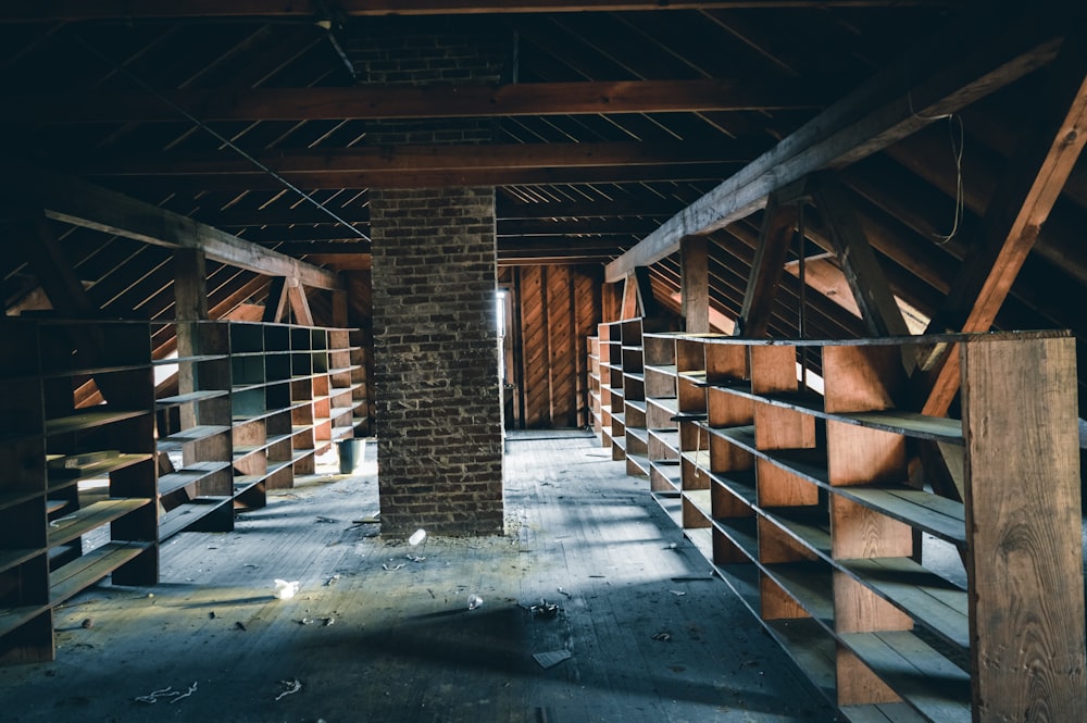 a room with a brick wall and wooden beams