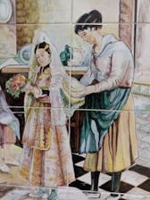 A painted ceramic tile mural features two figures in traditional attire, with one person adjusting or holding the veil of another who is dressed elegantly and holding a bouquet. The background includes pottery and a checkered floor pattern.