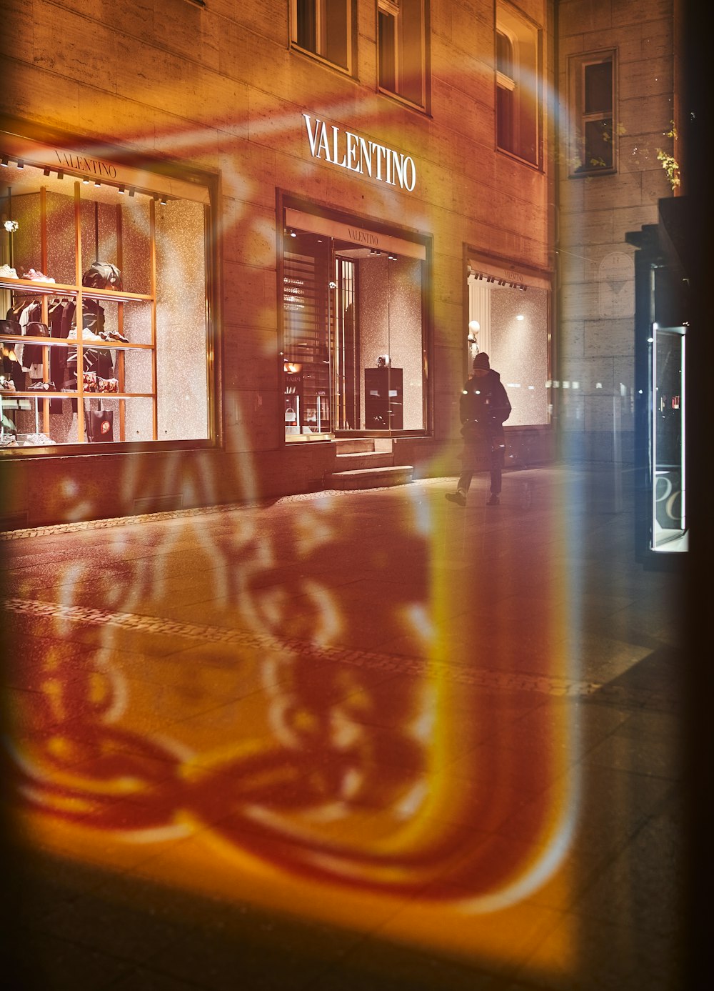 a window display of a store front at night