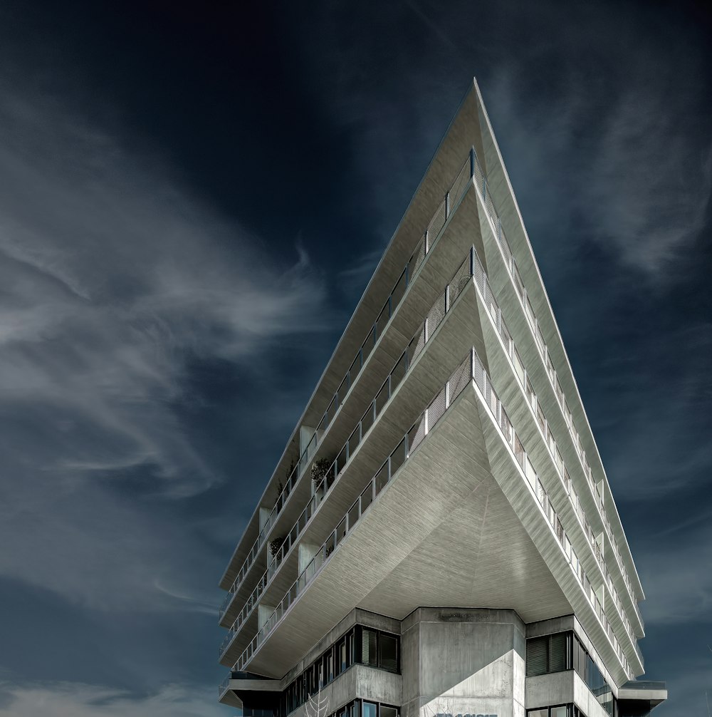 a very tall building sitting on top of a beach