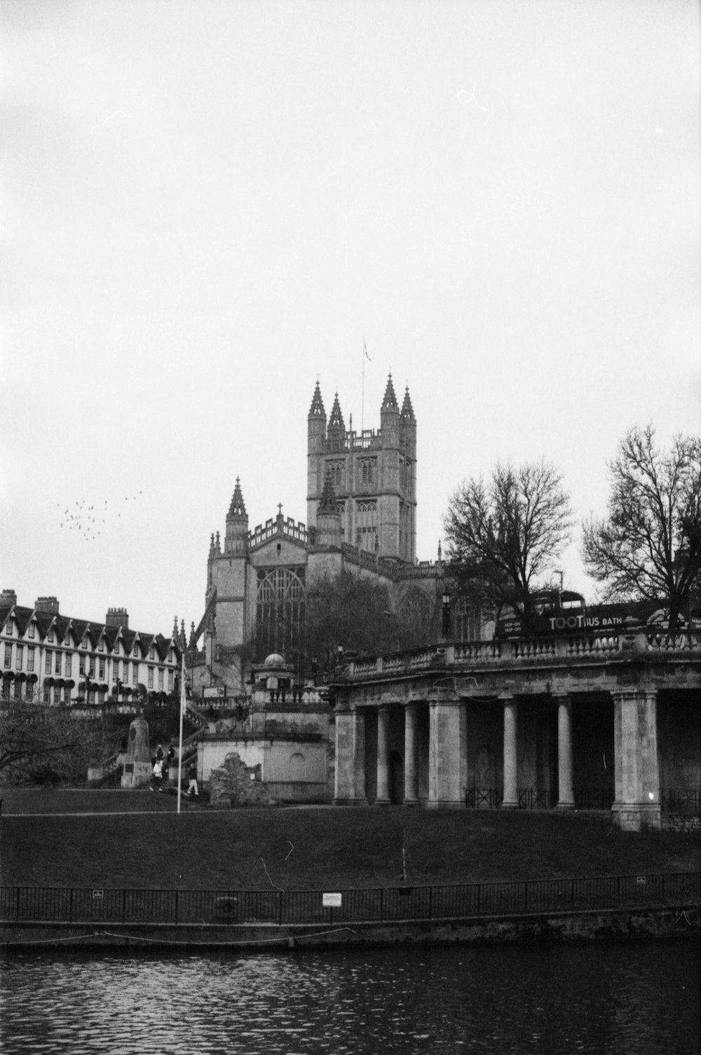 a black and white photo of a castle on a hill