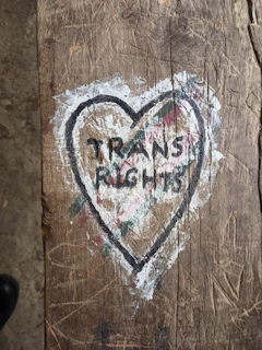 a piece of wood with a heart painted on it