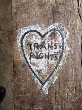 a piece of wood with a heart painted on it