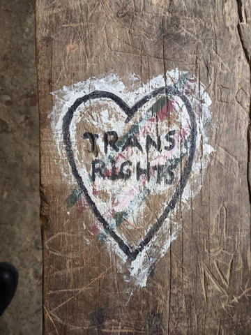 a piece of wood with a heart painted on it