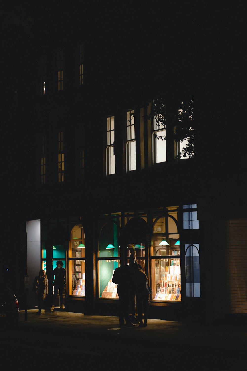 a couple of people that are standing in front of a building