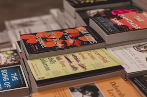 a bunch of books sitting on top of a table