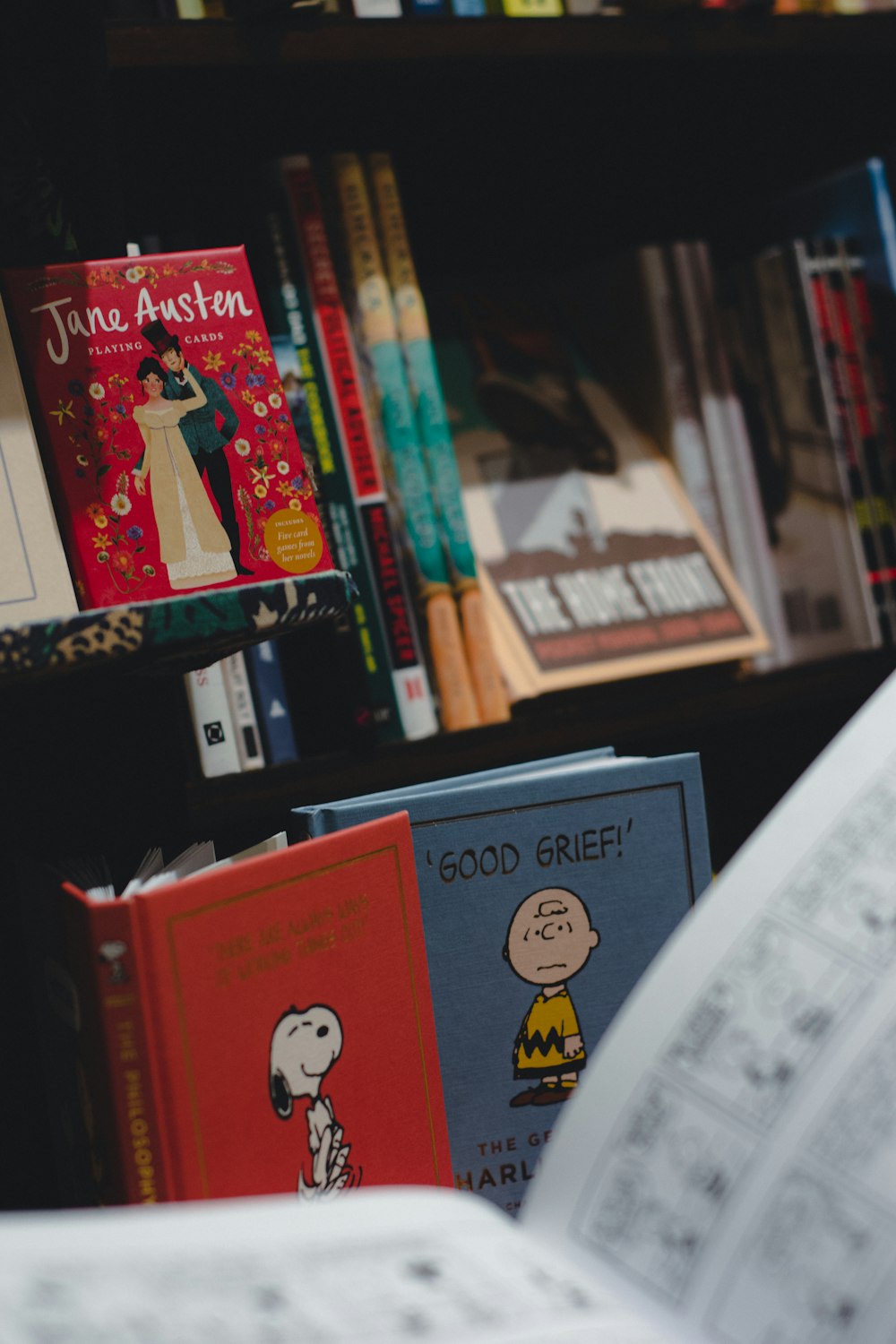 a bookshelf filled with lots of books and children's books