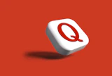 a white object with a red q on it