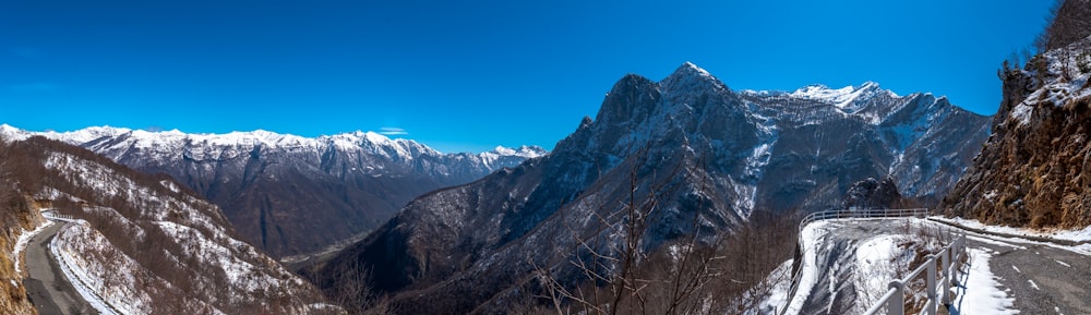 a view of a mountain range with snow on it