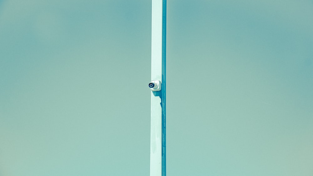 a tall pole with a camera attached to it