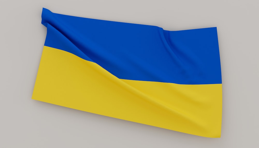 a blue and yellow flag on a gray background