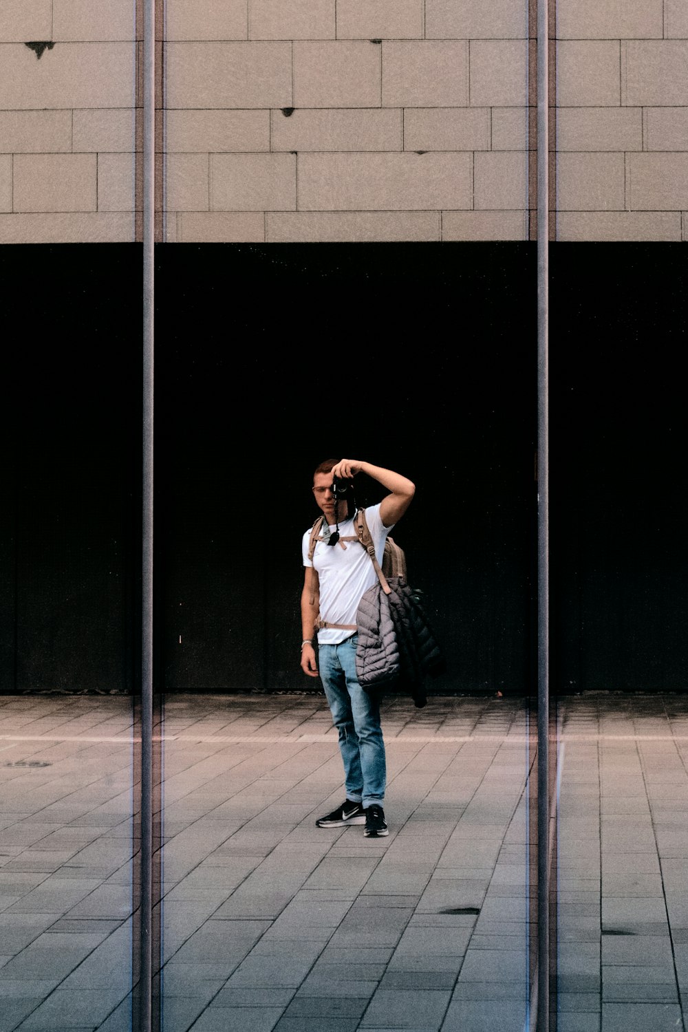 a man taking a picture of himself in a mirror