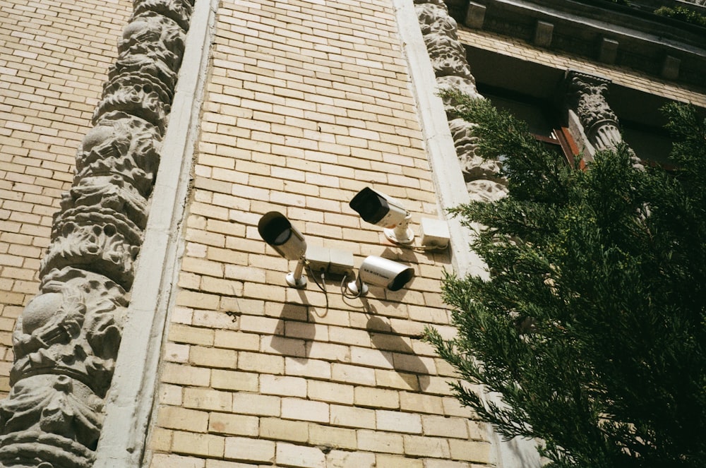 a couple of lights that are on the side of a building