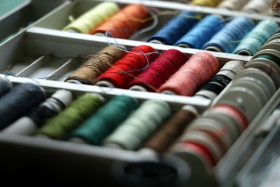 Close-up of colorful sewing trims and buttons neatly arranged.