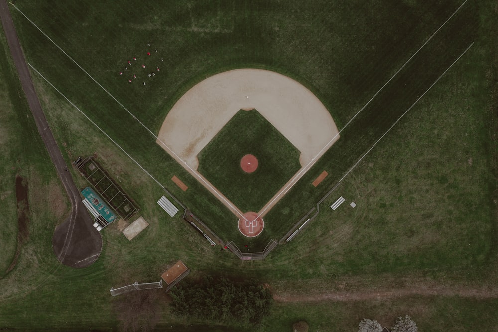 an aerial view of a baseball field with a red ball