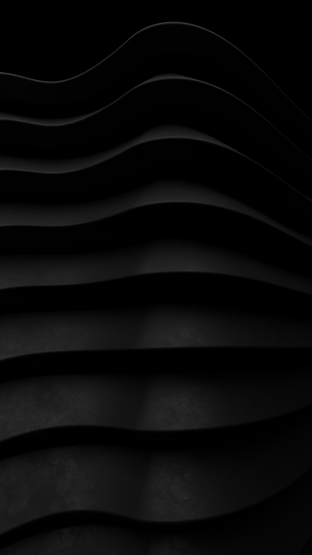 Une photo en noir et blanc de lignes ondulées