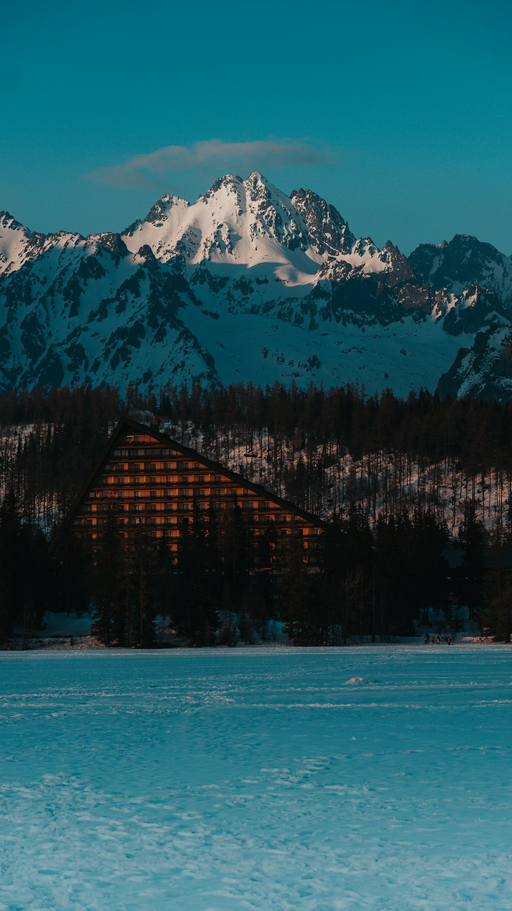 a large building sitting in the middle of a lake