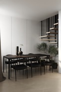 A modern dining area featuring sleek chairs and a centerpiece from ravnora decor.