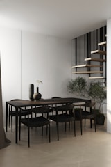 A modern dining area featuring a sleek dining table.